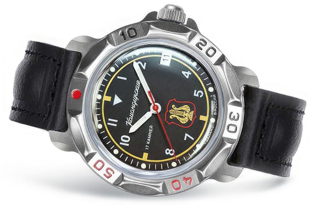 Vostok Komandirskie 81642B - close-up diagonal view of black dial, military orchestra emblem, case and black leather strap