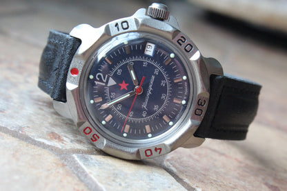 Vostok Komandirskie 816398 - diagonal front view with dark blue military emblem dial, complete case and crown, 12 oclock toward upper left