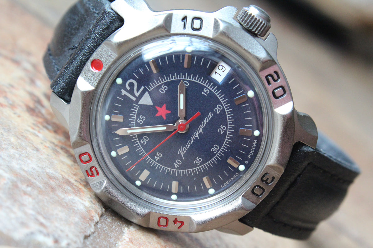 Vostok Komandirskie 816398 - close-up of dark blue military emblem dial and date window