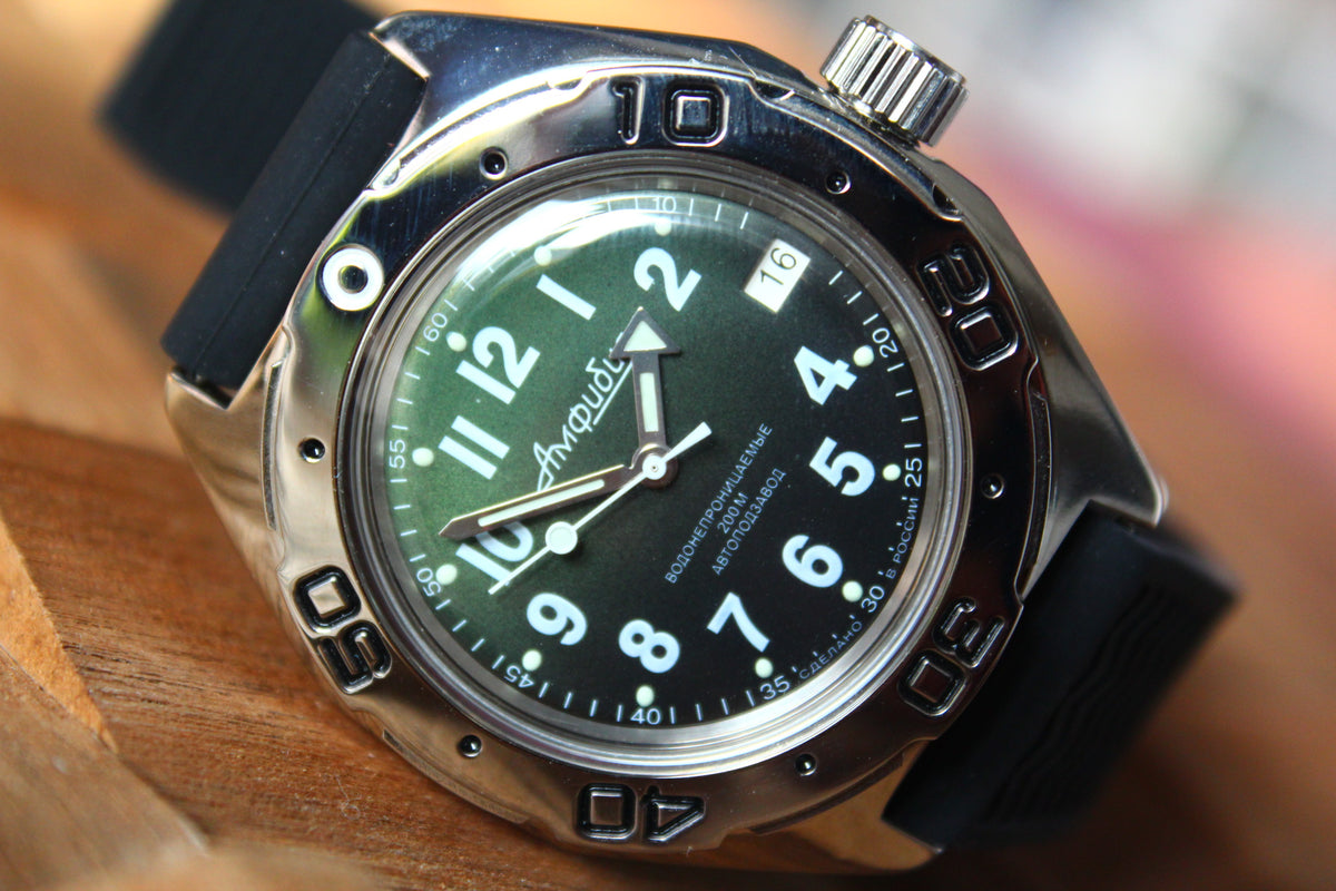 Vostok Amphibia 67068B - diagonal front view with green dial, complete case and black strap