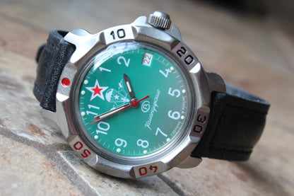 Vostok Komandirskie 816307 - diagonal front view with green military emblem dial, complete case and crown, 12 oclock toward upper left