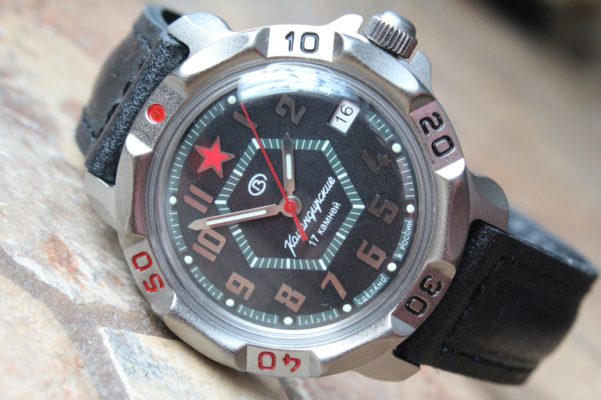 Vostok Komandirskie 816744 - close-up of black geometric military emblem dial and date window