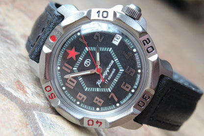 Vostok Komandirskie 816744 - close-up of black geometric military emblem dial and date window