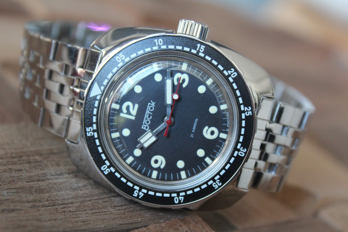 Vostok Amphibia 71067A - diagonal front view showing black dial and complete stainless steel case