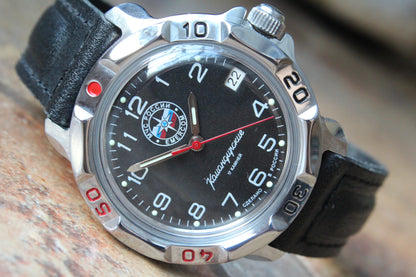 Vostok Komandirskie 811951 - close-up of black EMERCOM emblem dial and bezel