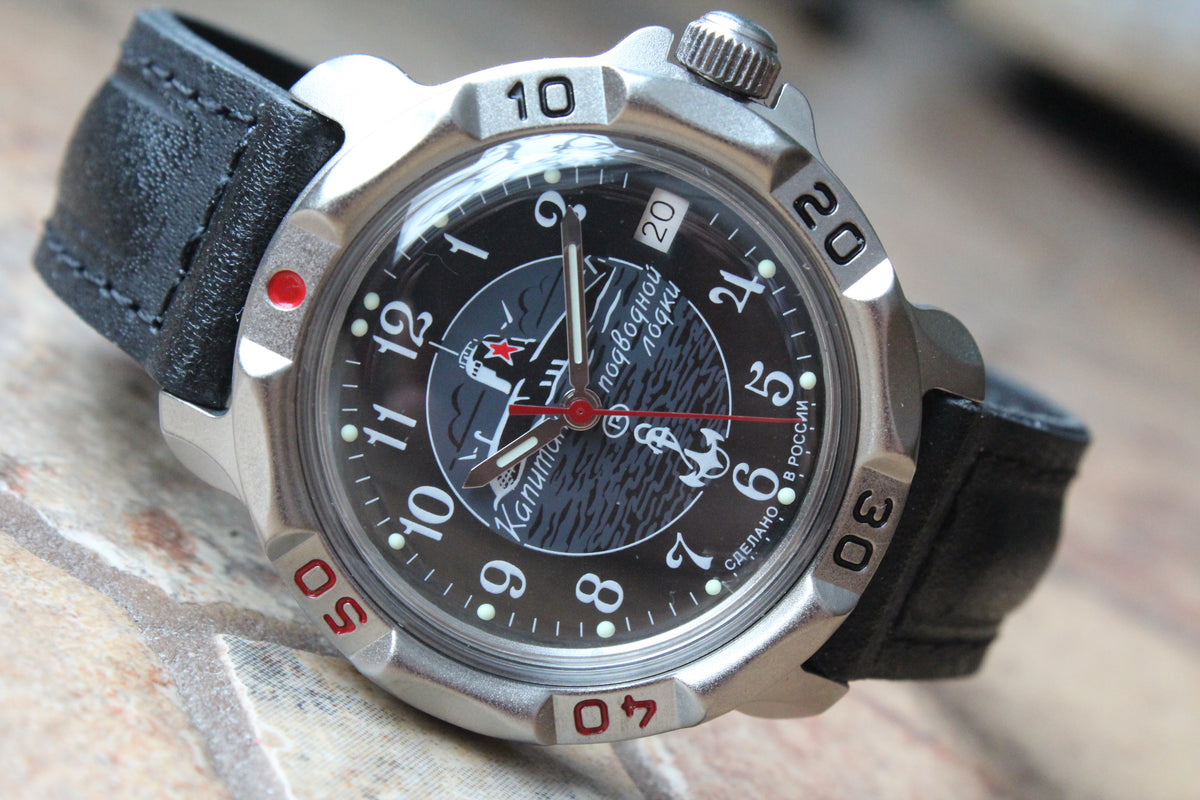 Vostok Komandirskie 816831 - diagonal front view with black submarine emblem dial, complete case and crown, 12 oclock toward upper left
