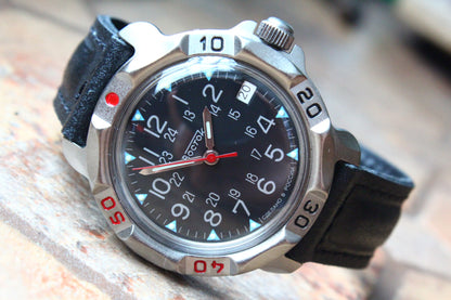 Vostok Komandirskie 816783 - diagonal front view with black military emblem dial, complete case and crown, 12 oclock toward upper left