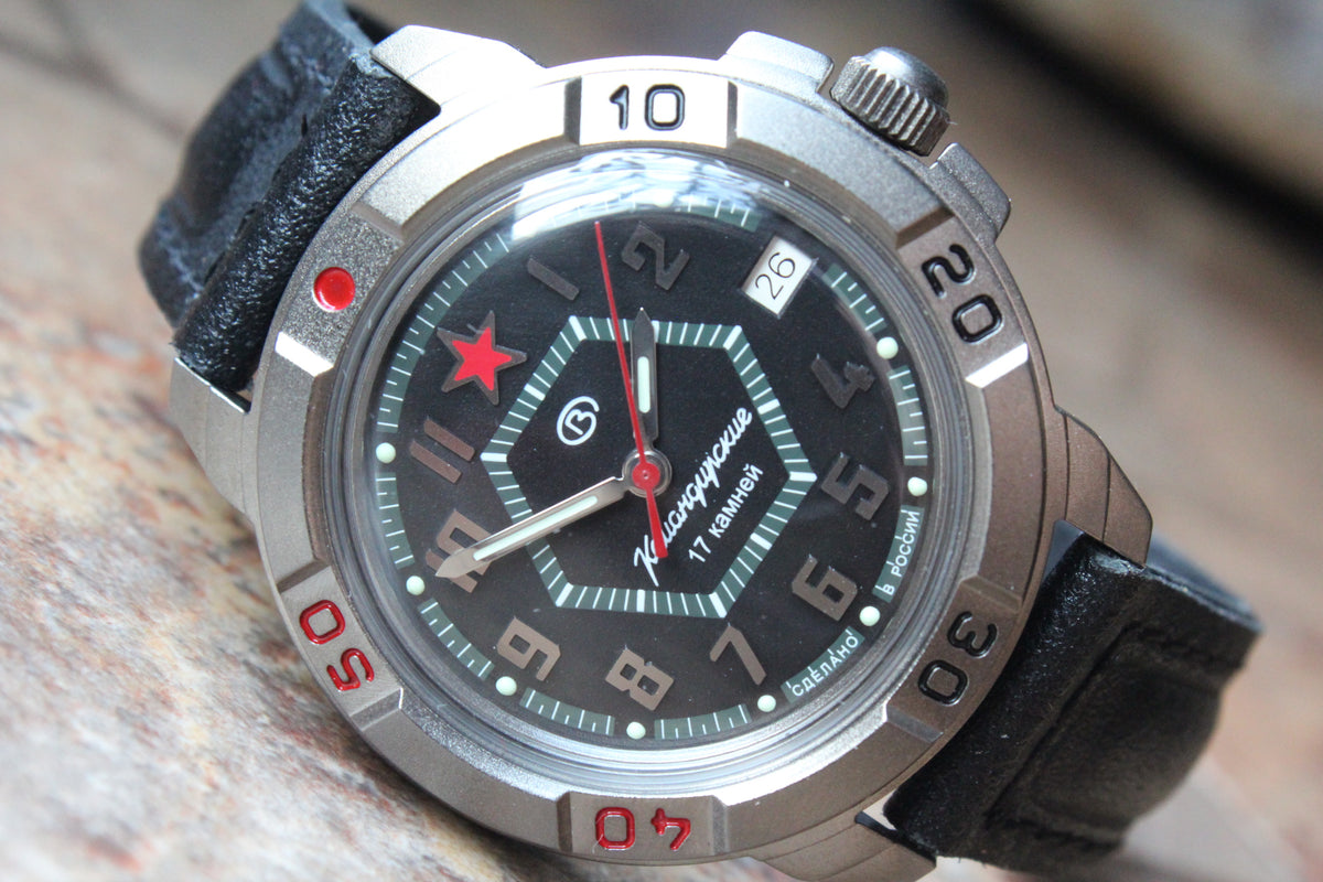 Vostok Komandirskie 436744 - diagonal front view of black dial with red star and leather strap