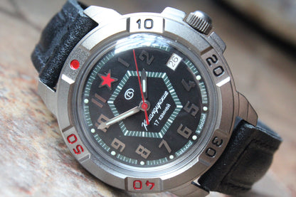Vostok Komandirskie 436744 - diagonal front view of black dial with red star and leather strap