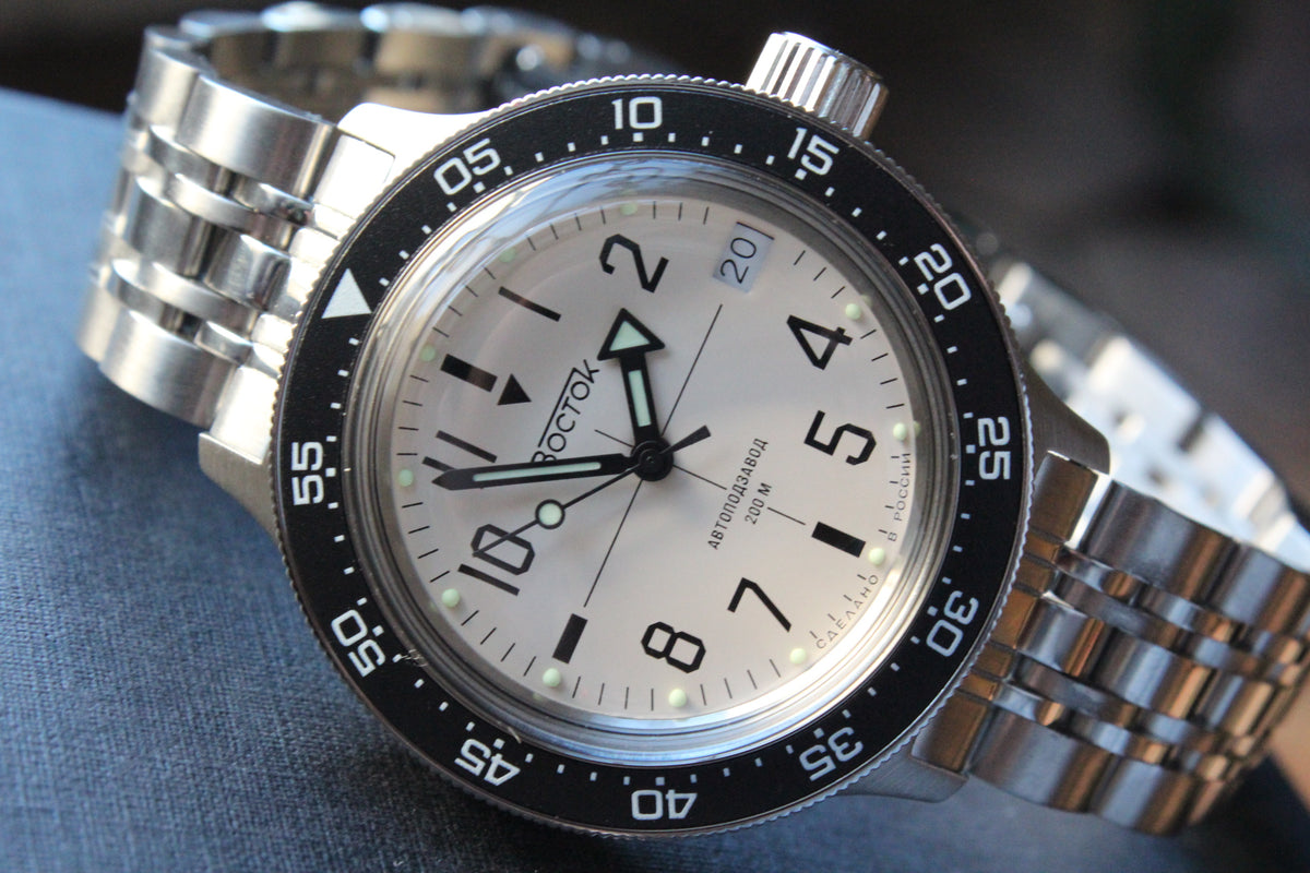 Vostok Amphibia 720070 - diagonal front view with white dial, complete case and stainless steel bracelet
