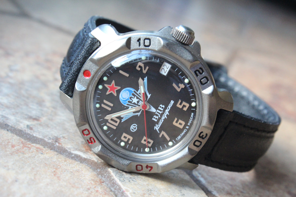 Vostok Komandirskie 816288 - diagonal front view with black paratrooper emblem dial, complete case and crown, 12 oclock toward upper left
