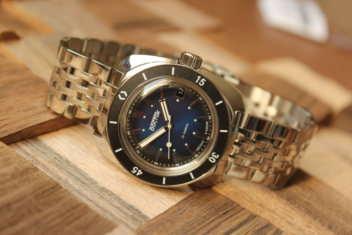 Vostok Amphibia 71001A - diagonal front view with blue dial, complete case, crown and bracelet