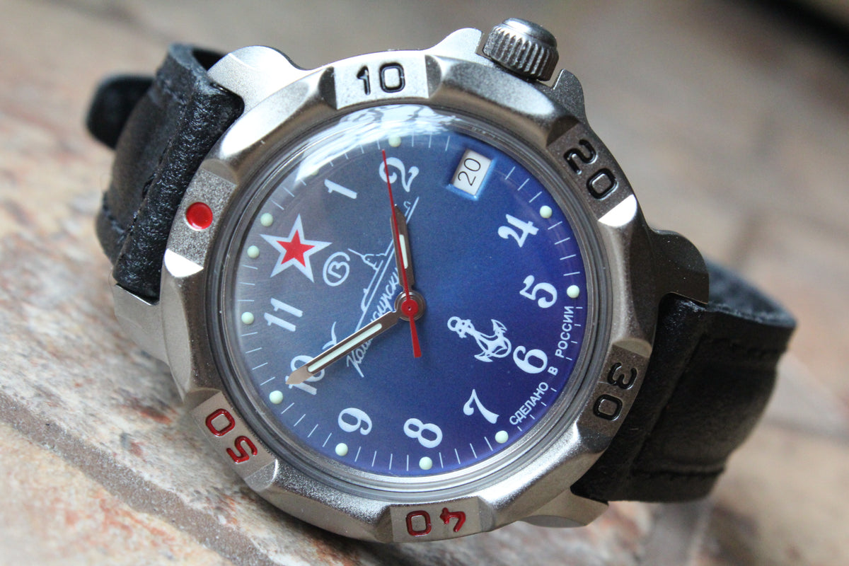 Vostok Komandirskie 816289 - close-up of blue naval emblem dial, date window and bezel