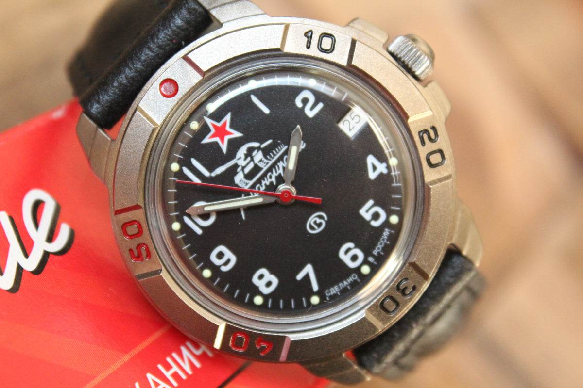 Vostok Komandirskie 436306 - front detail of watch beside red Komandirskie box