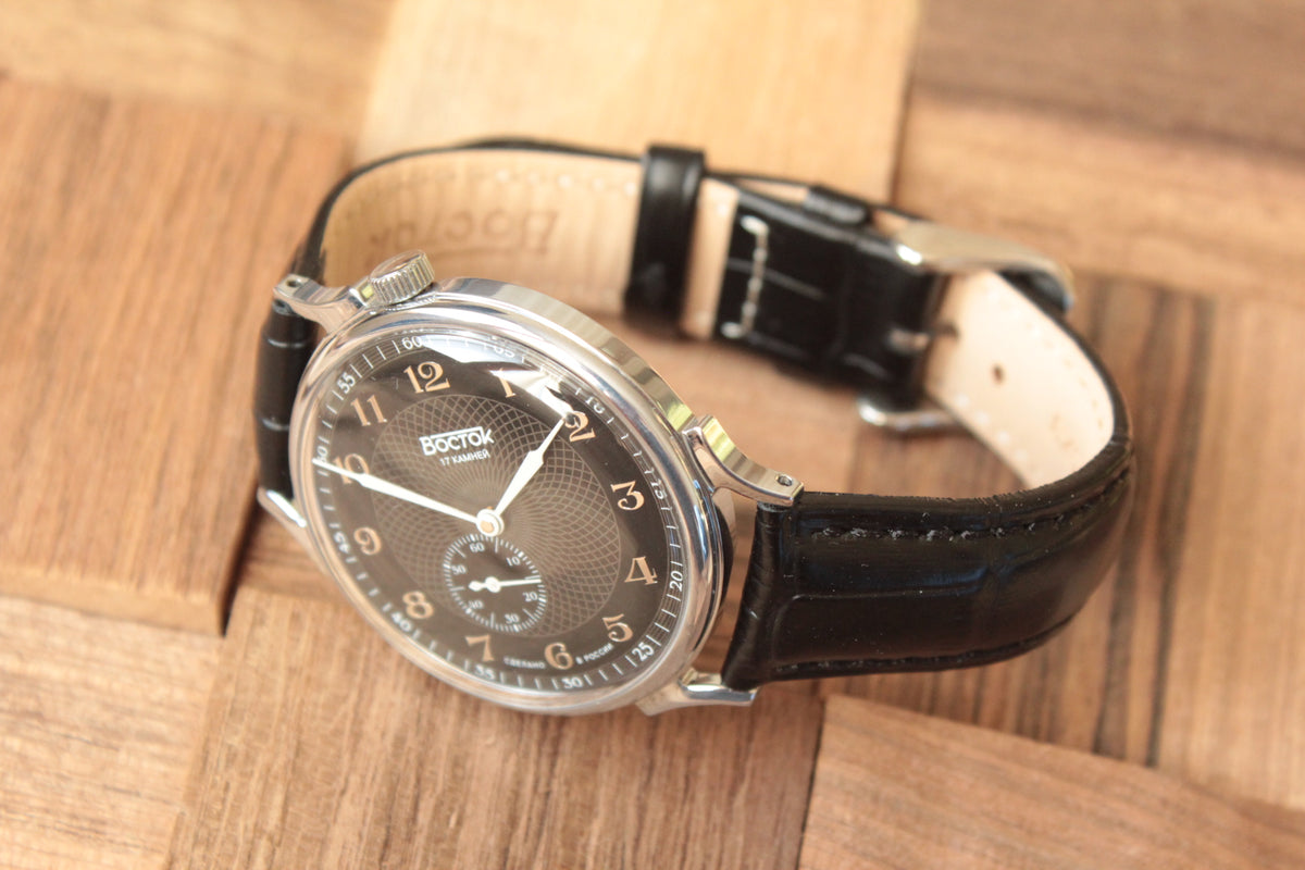 Vostok 581098 - diagonal front view with curved leather strap