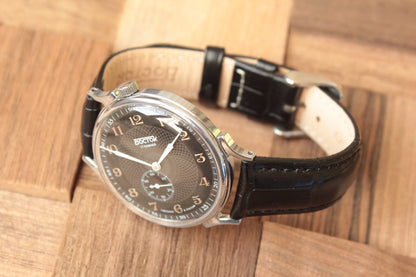 Vostok 581098 - diagonal front view with curved leather strap