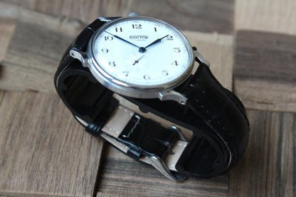 Vostok 581096 - diagonal front view with curved leather strap