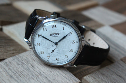 Vostok 581096 - diagonal front view with curved leather strap