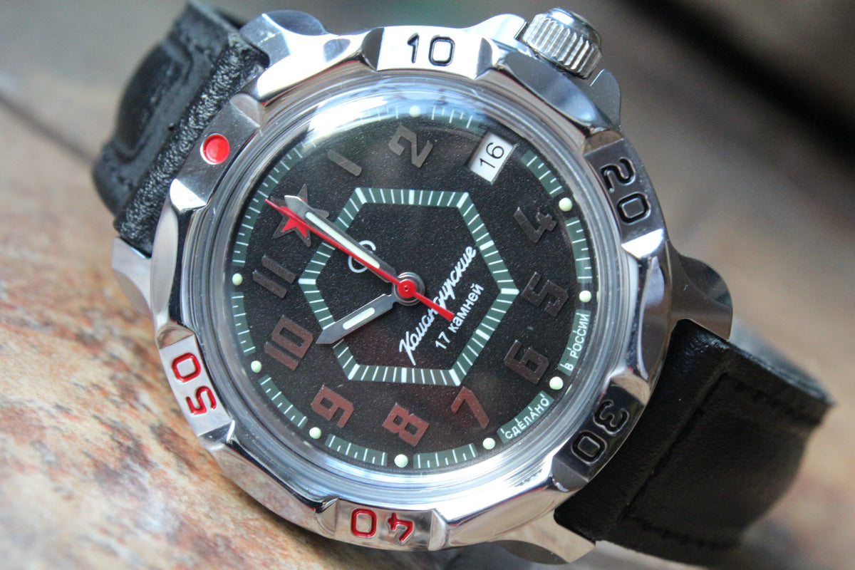 Vostok Komandirskie 811744 - diagonal front view with complete dial, case and crown, 12 oclock facing left