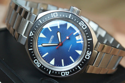 Vostok Amphibia 780446 - diagonal front view with blue dial, complete case and crown