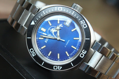Vostok Amphibia 78010A - diagonal front view with blue diver dial, complete case and crown