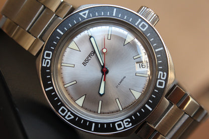 Vostok Amphibia 780830 - diagonal front view with silver dial, complete case and crown