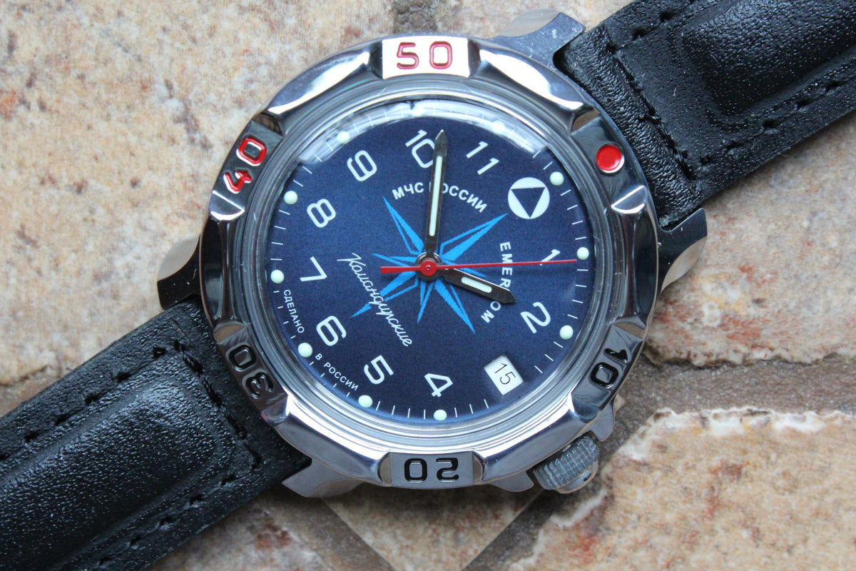 Vostok Komandirskie 811942 - close-up of blue EMERCOM emblem dial and bezel