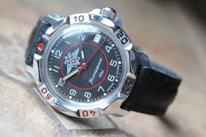 Vostok Komandirskie 811952 - diagonal front view with black eagle emblem dial, complete case and crown