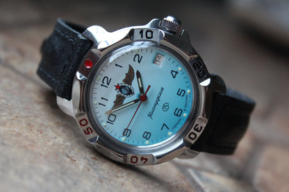 Vostok Komandirskie 811958 - diagonal front view with light blue winged emblem dial, complete case and crown, 12 oclock toward upper left
