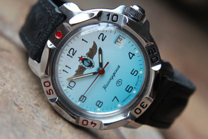 Vostok Komandirskie 811958 - close-up of light blue winged emblem dial, date window and bezel