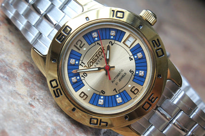 Vostok Partner 299097 - diagonal front view of blue and silver dial with steel bracelet