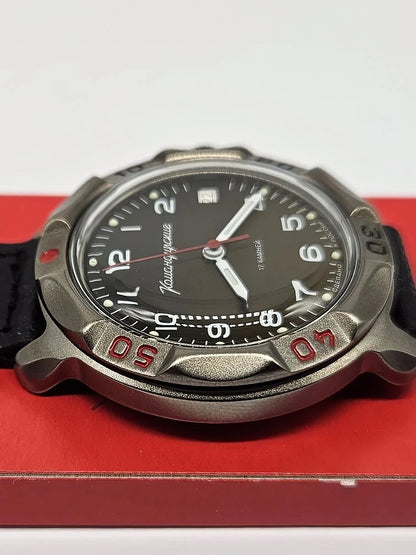 Vostok Komandirskie 81688B - low-angle view of case and crystal on red presentation box